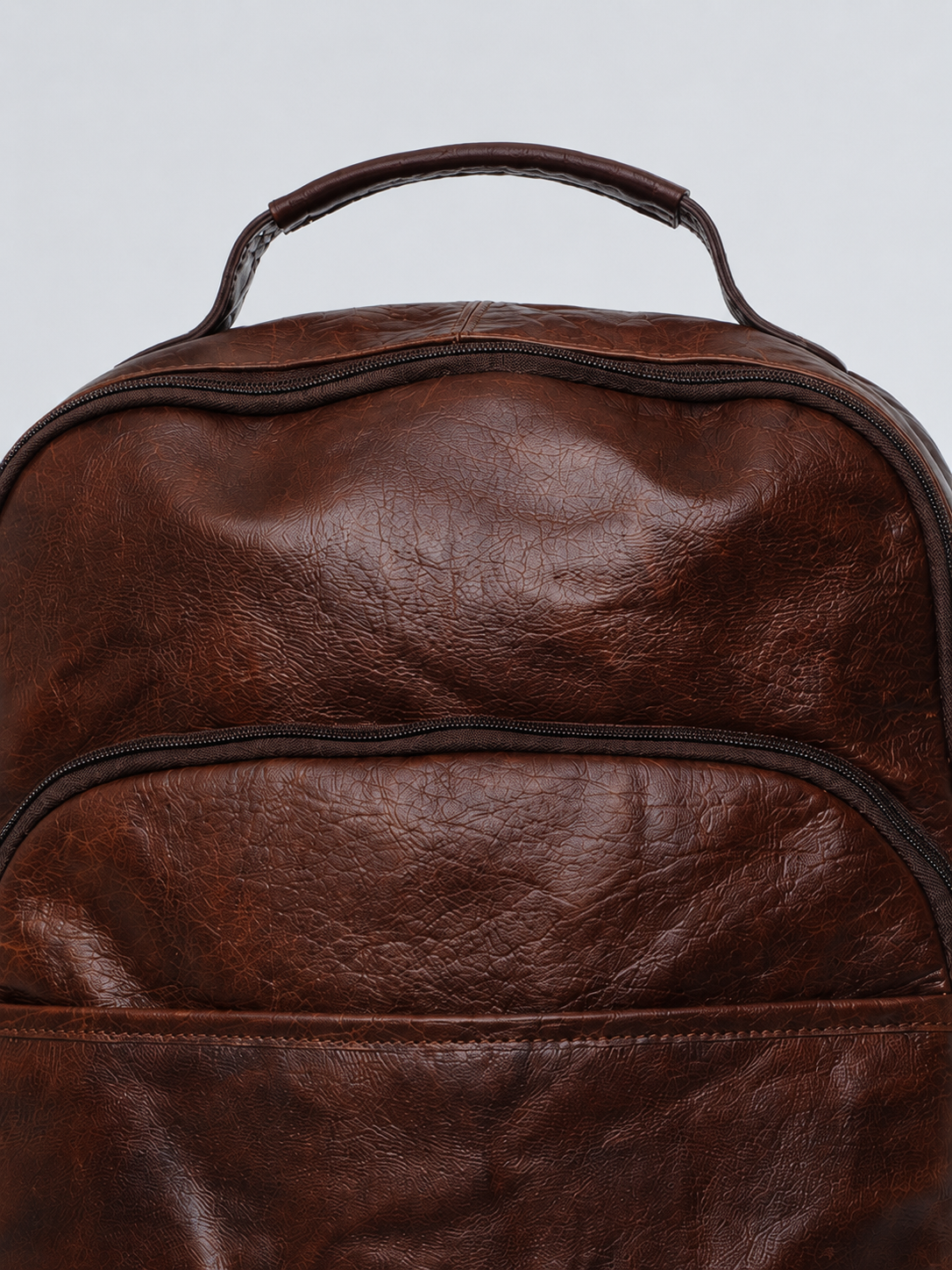 LEATHER BACKPACK WITH TRIPLE COMPARTMENT